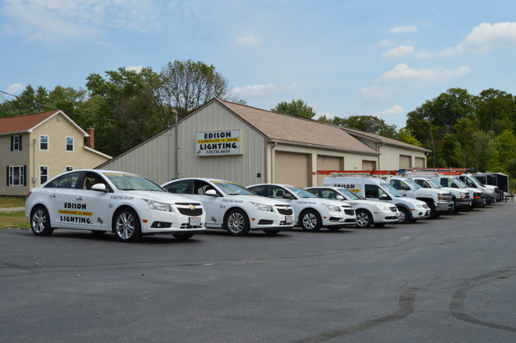 Fleet of Edison vehicles at Edison Lighting warehouse