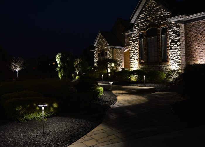 Illuminated front walkway of residential house