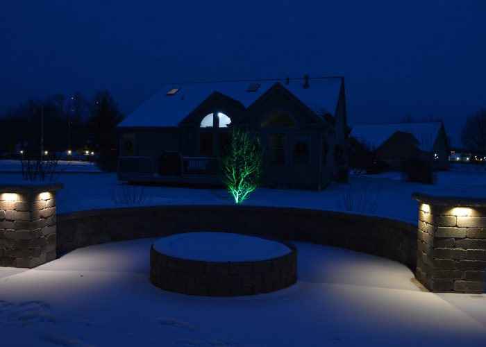 Backyard patio lighting covered in snow